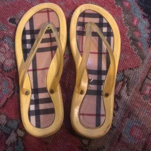 Yellow Burberry flip flops.  Willing to negotiate.